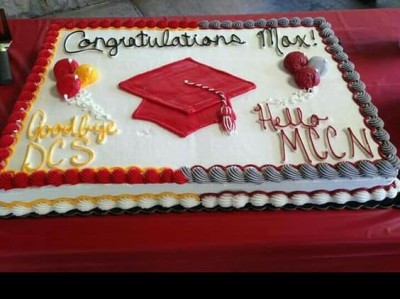 sheet cake with high school on one side and college on other