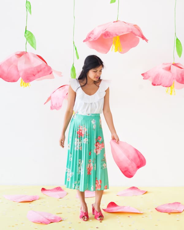 hanging flowers with woman