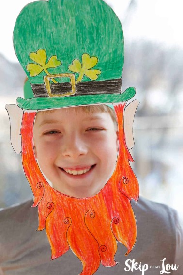 boy wearing leprechaun mask