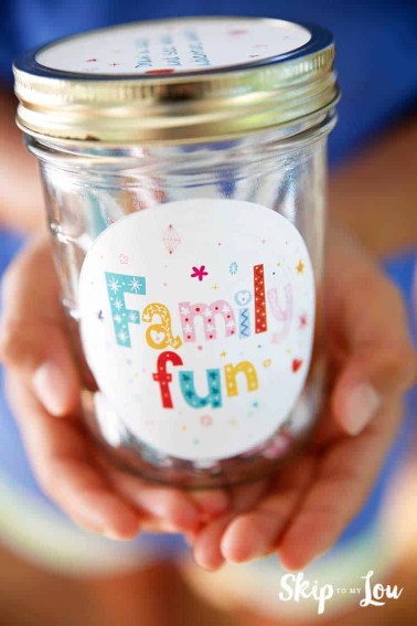 hands holding family fun activity jar