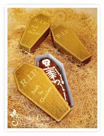 Three coffin treat boxes with skeleton chocolate treat inside by Squishy-Cute Designs; the coffin is made from a printable template