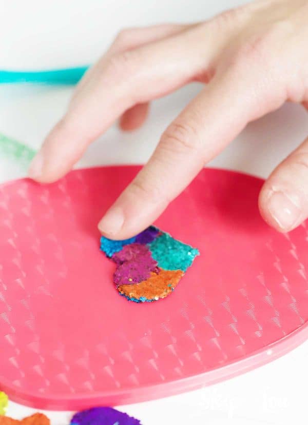 placing heart on back of hand held mirror