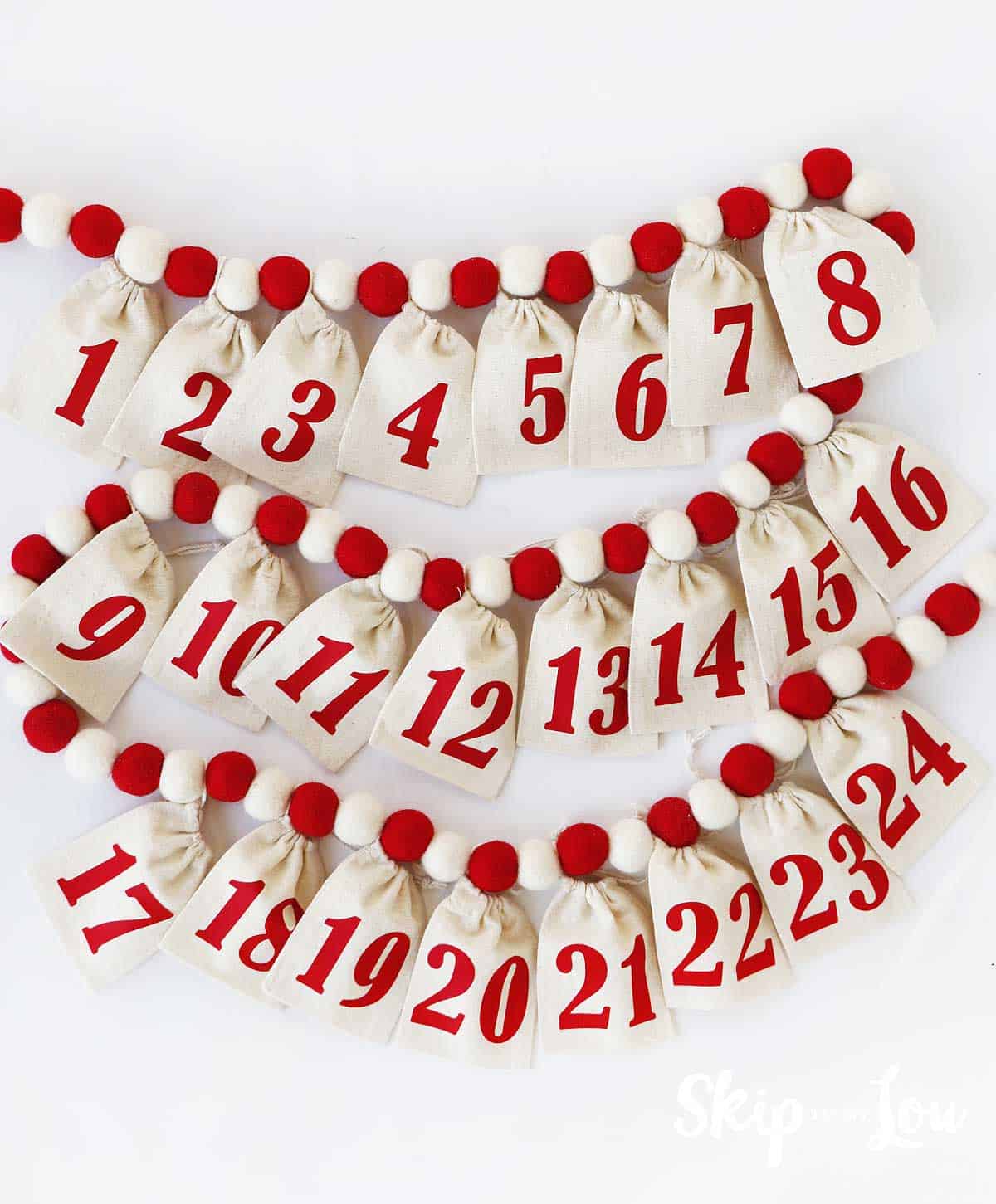 DIY advent calendar muslin numbered bags on felted ball garland