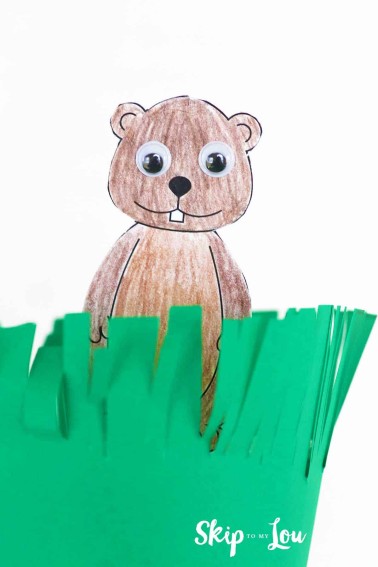 printable groundhog peeking out of a cup covered in green paper