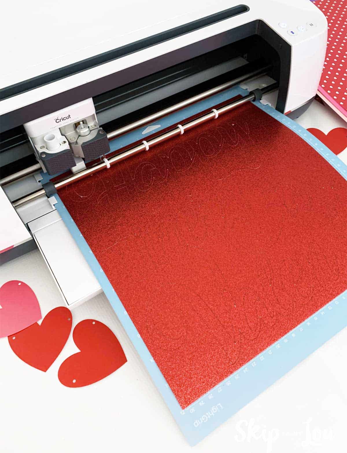 red glitter cardstock loaded in Cricut Maker