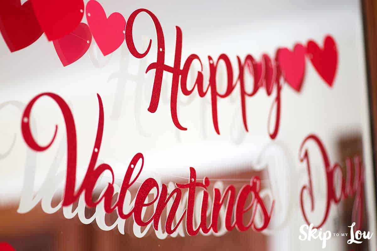 Red Glitter Valentine Banner hanging on mirror