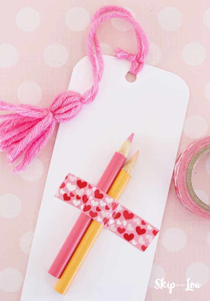 colored pencils attached to back of printable bookmark with washi tape