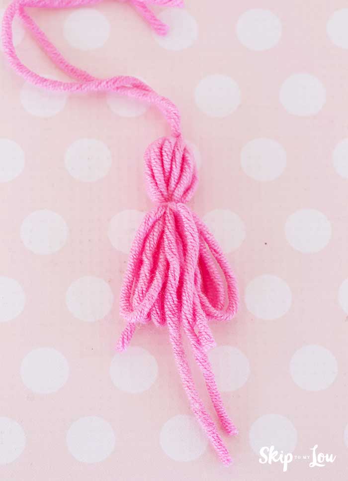 tie knot around tassel