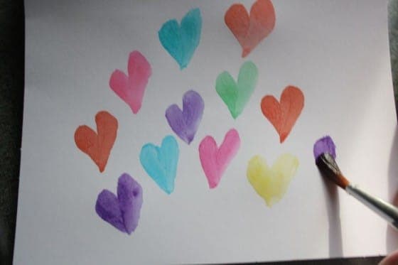 watercolor hearts painted on white paper