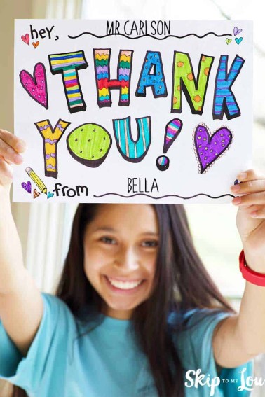 child holding printable thank you sign hand colored