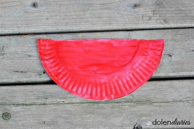 Half of paper plate painted red