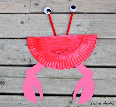Smile added to red paper plate crab