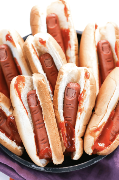 Image shows multiple hot dogs with the sausages looking like severed fingers.