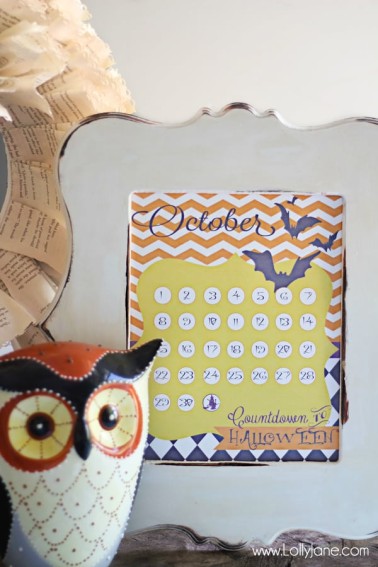 countdown calendar in white frame ceramic owl sitting next to it