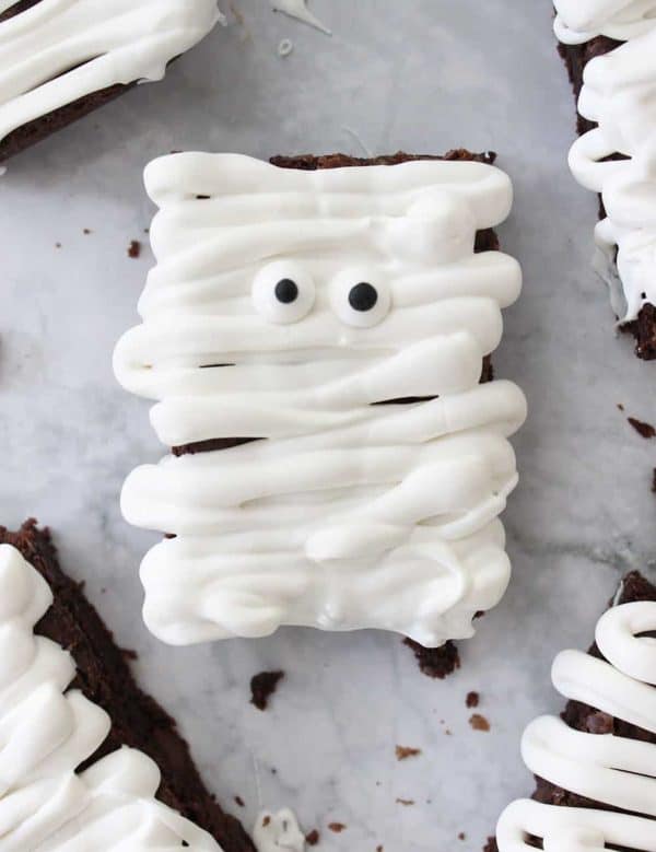 Image shows a picture of a brownie decorated as a mummy for Halloween