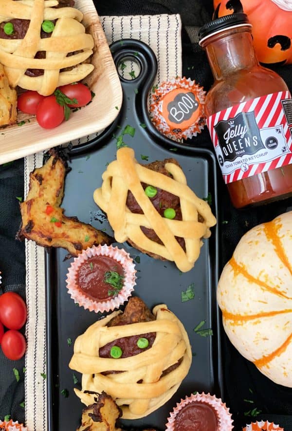 Image shows a platter with mini meatloaves and other Halloween-inspired meals.