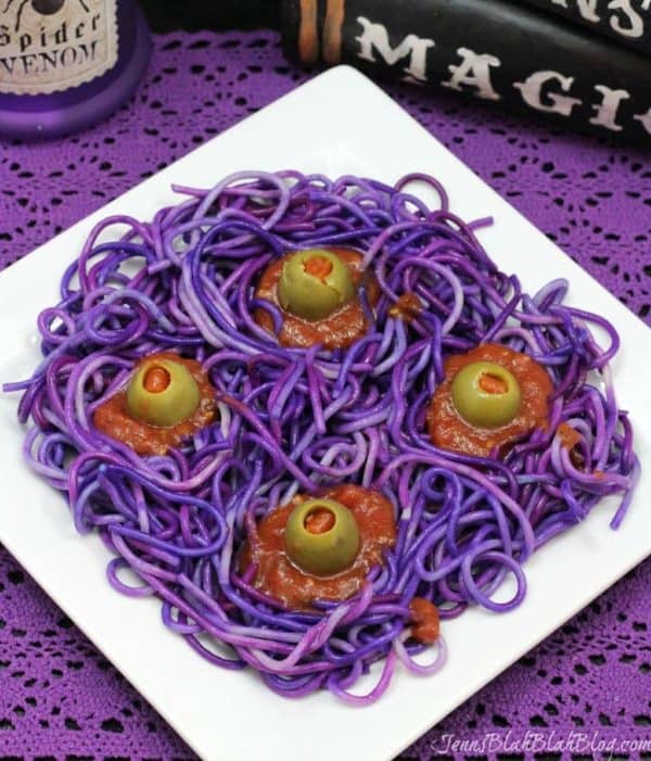 Image shows a purple spagheti with olives to look like eyes