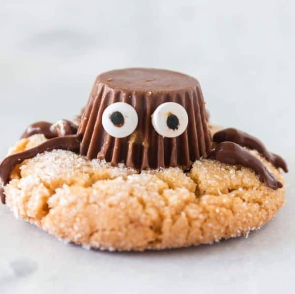 Image shows a cookie with a reese's chocolate to look like a spider