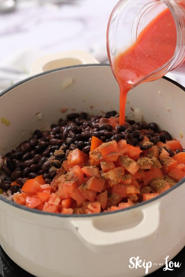 canned black beans, tomatoes and tomato sauce added to the sauted veggies and meat mixture