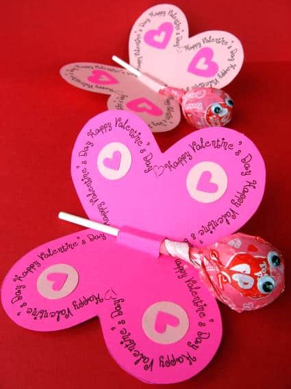 pink butterfly valentine with a tootsie pop inserted to make the head and body