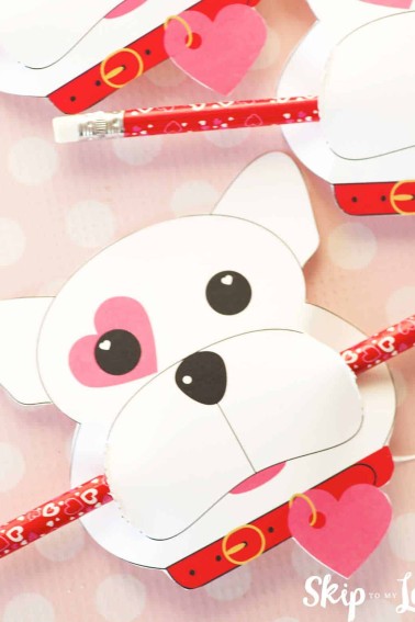 puppy dog valentine with a pencil in mouth