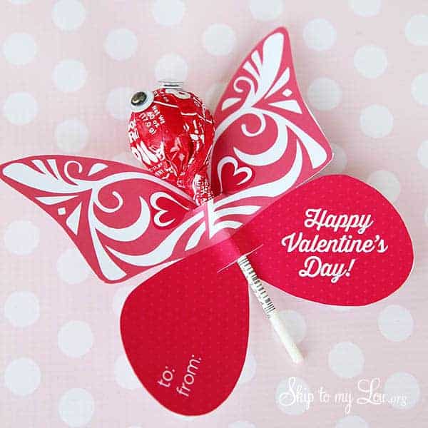 red and white butterfly valentine with a tootsie pop inserted to make the head and body