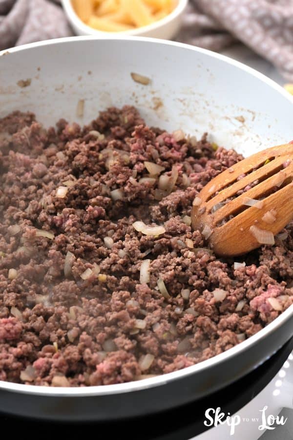 ground beef or sausage and onion browning in a skillet