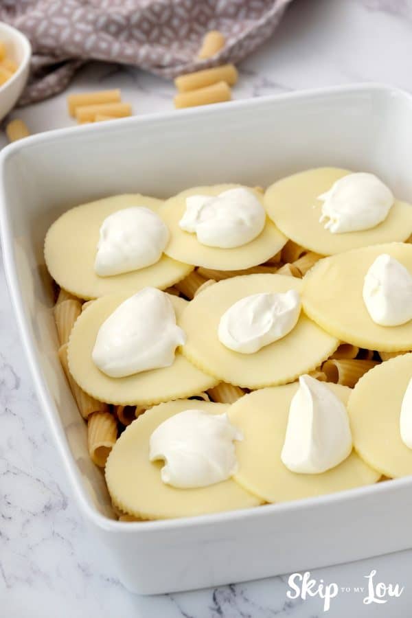 meat sauce, penne pasta, provolone slices and sour cream layered layered in a casserole dish