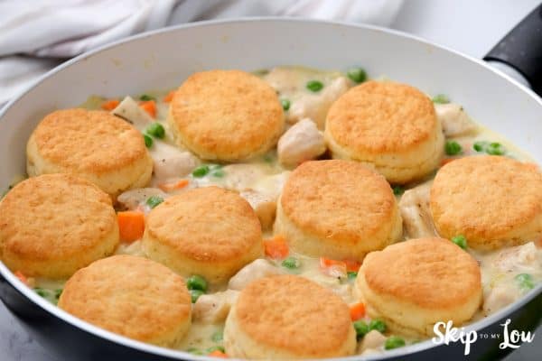 Chicken pot pie with biscuits ready to serve in a pan. -Skip To My Lou