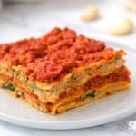 layered gluten free dairy free lasagna served on a white plate