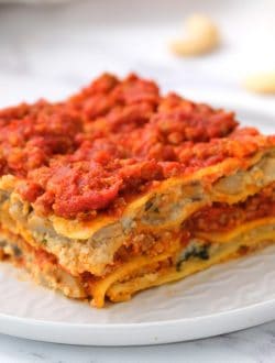 layered gluten free dairy free lasagna served on a white plate
