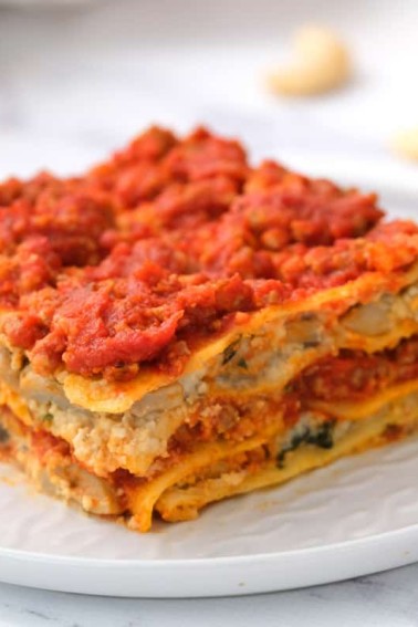 layered gluten free dairy free lasagna served on a white plate