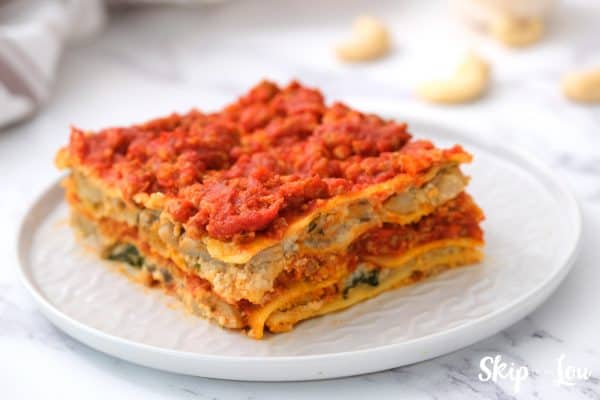 layered gluten-free dairy-free lasagna served on a white plate
