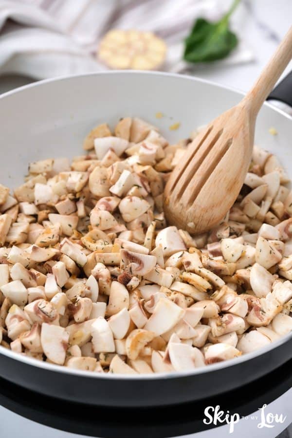 chopped mushrooms, Tamara, and thyme added to the sauted garlic to cook