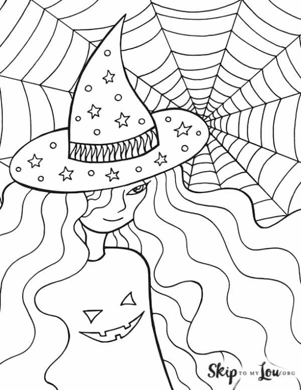 witch with spider web and wearing jack o lantern shirt