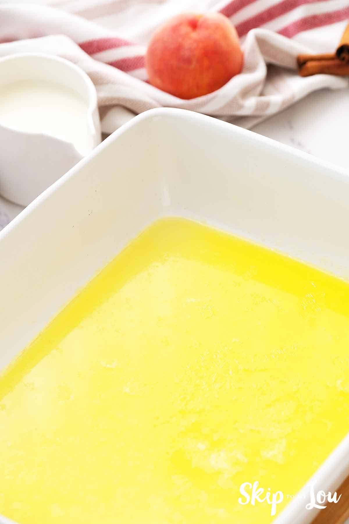 melted butter in white casserole dish