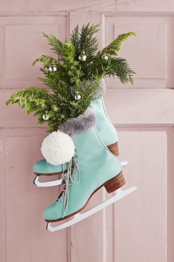 Image shows a Christmas ice skate wreath made with ice skates.