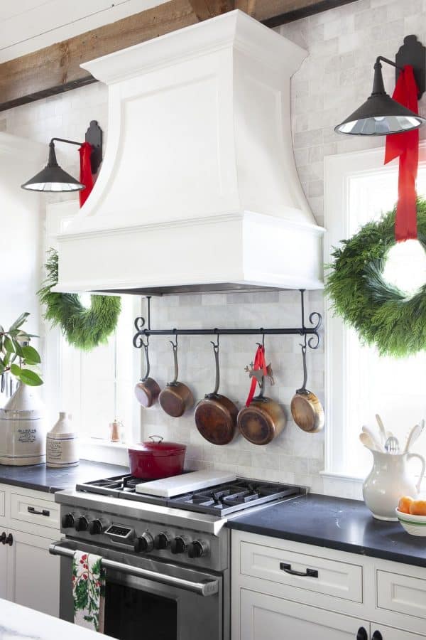 Image shows hanging holiday wreaths in a kitchen.