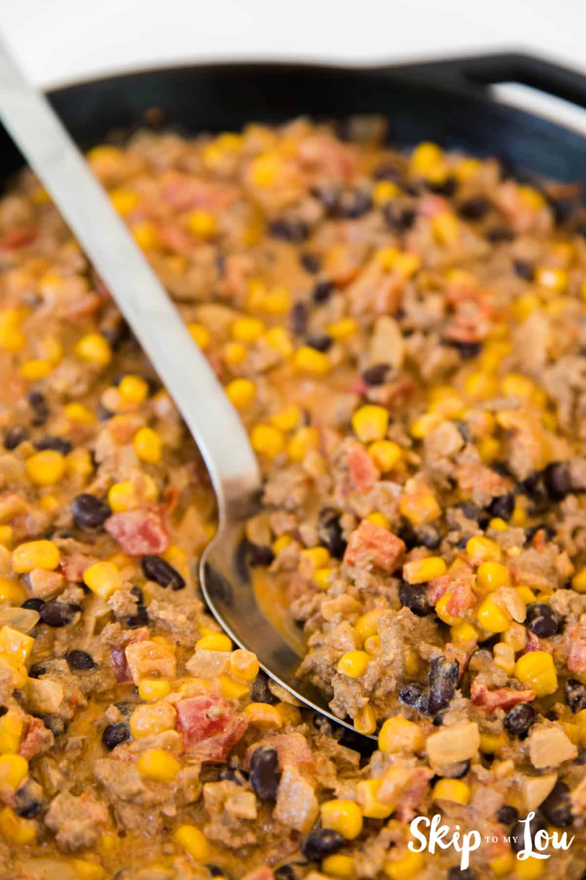 taco meat mixture in cast iron skillet