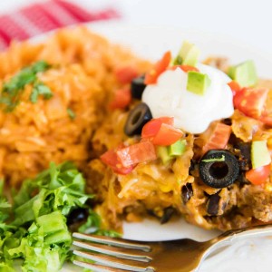 Doritos Casserole recipe on plate with side of rice