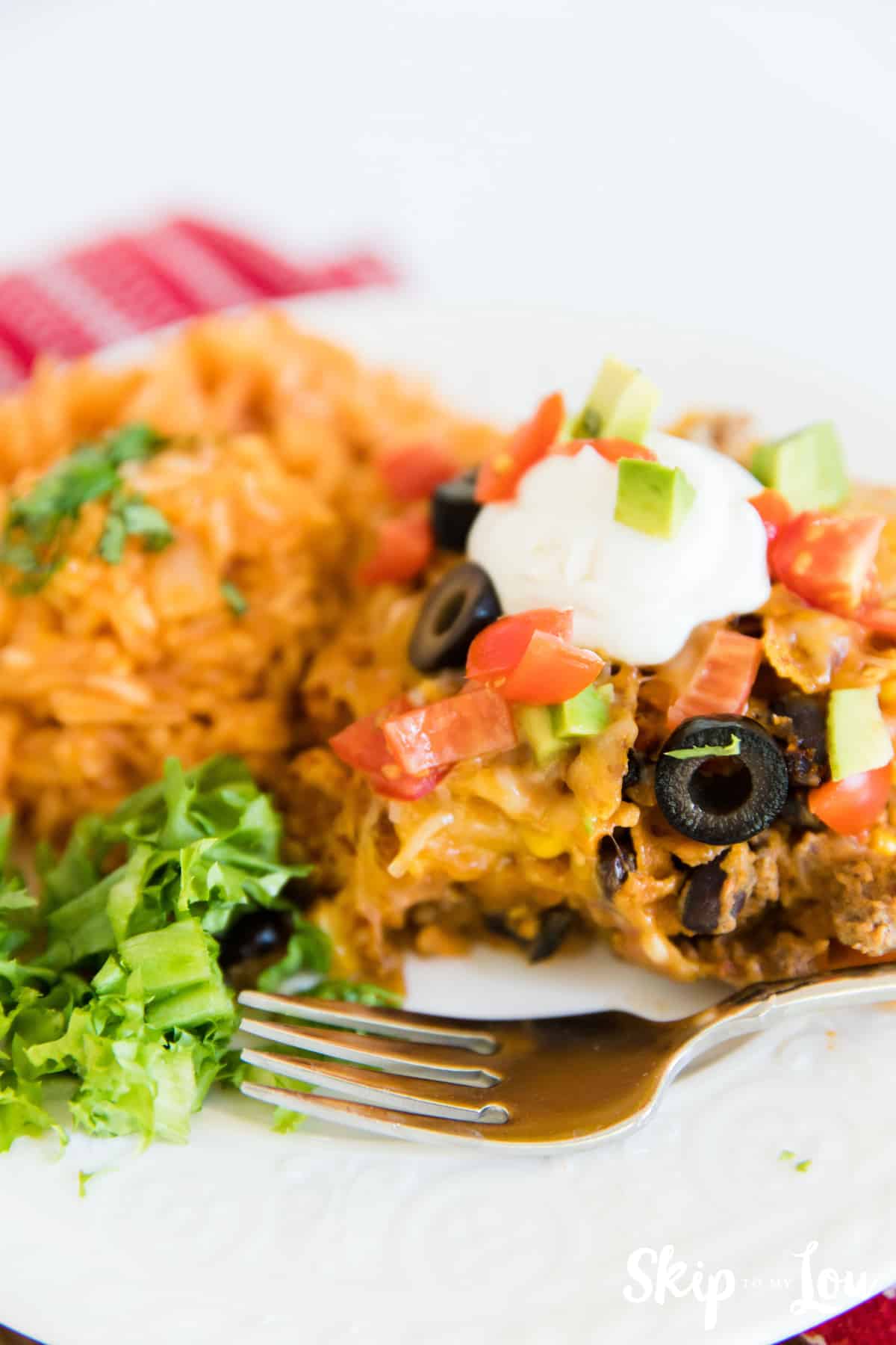 Doritos Casserole recipe on plate with side of rice
