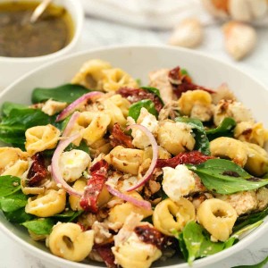 tortellini salad in white bowl