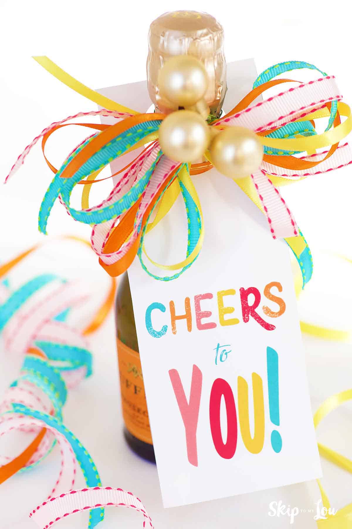Image shows a wine with a gift tag that says "Cheers to you!" - Skip to my Lou