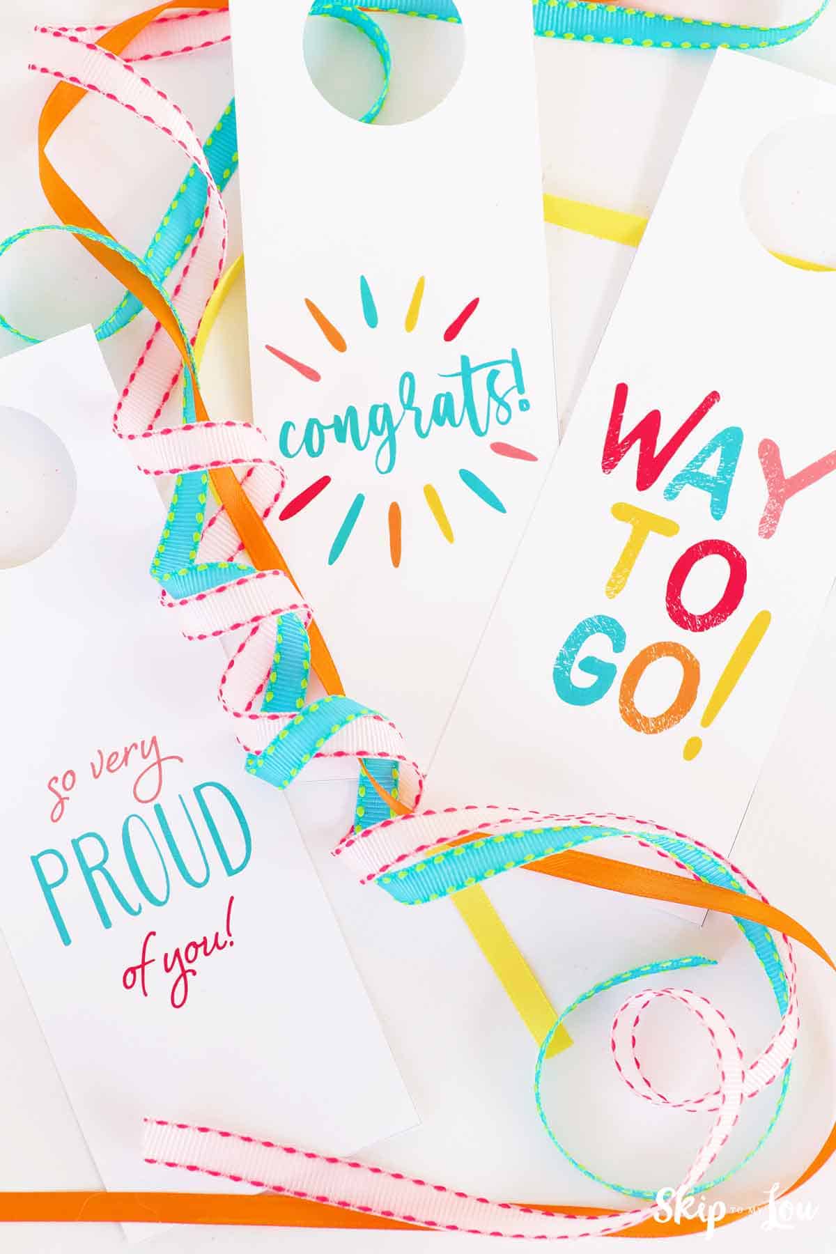Image shows three wine tags to congratulate people, the text reads: So very proud of you, Way to go, and Congrats!
