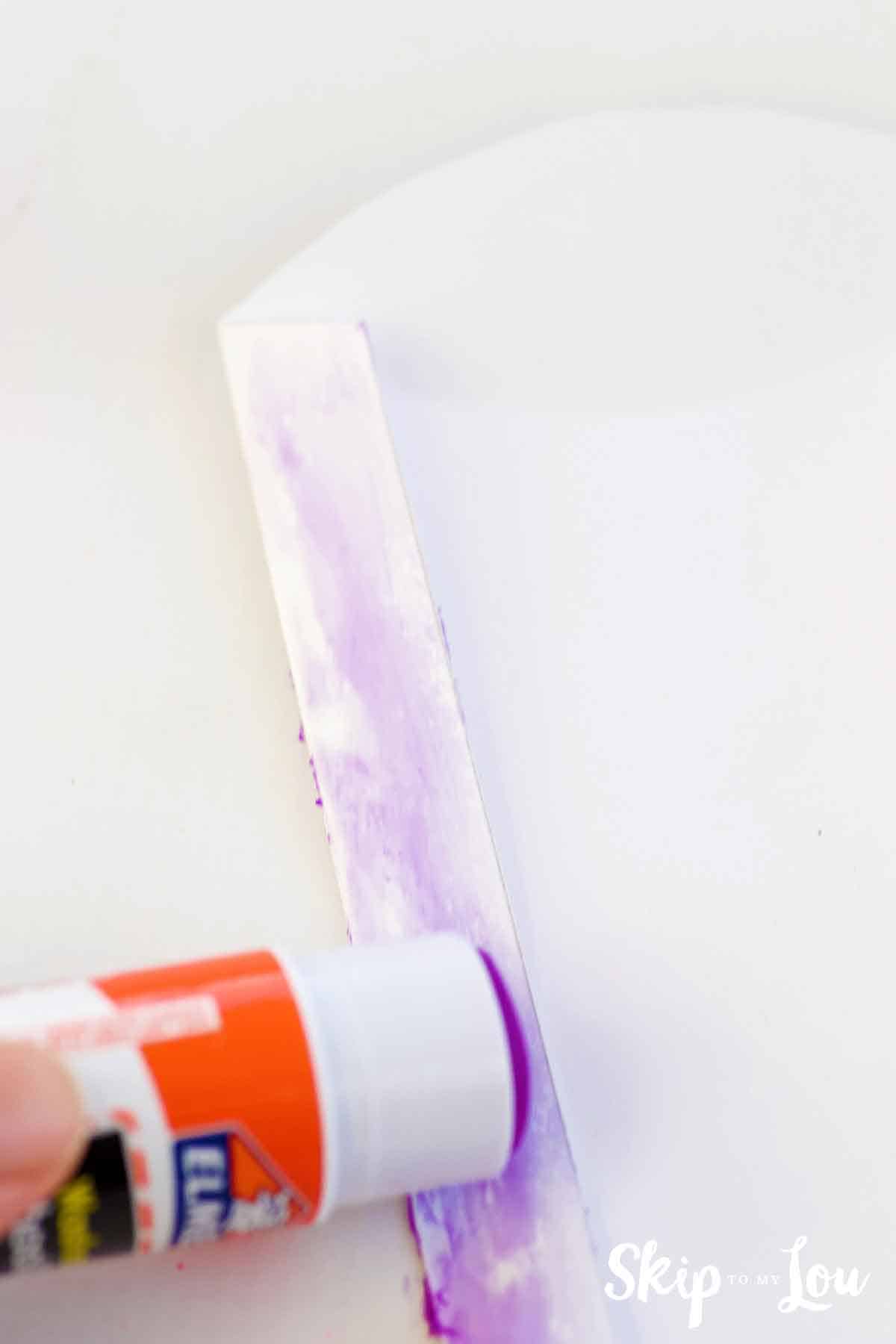 placing glue on flat of DIY lottery ticket pillow box