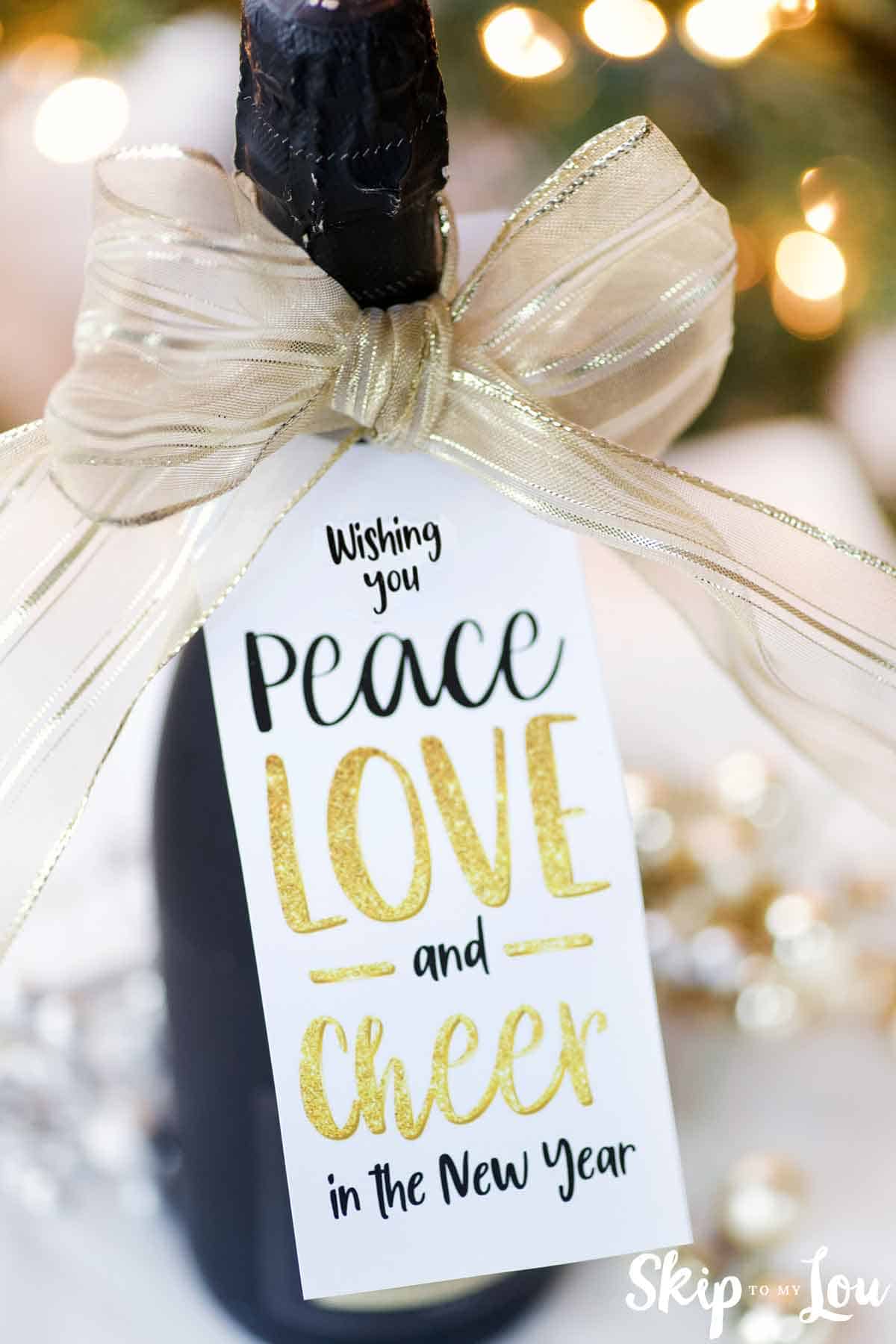 Near Year gift tag on a bottle of champagne