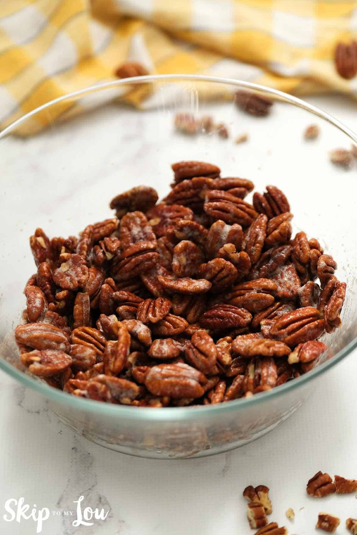 pecans in bowl coated with egg white