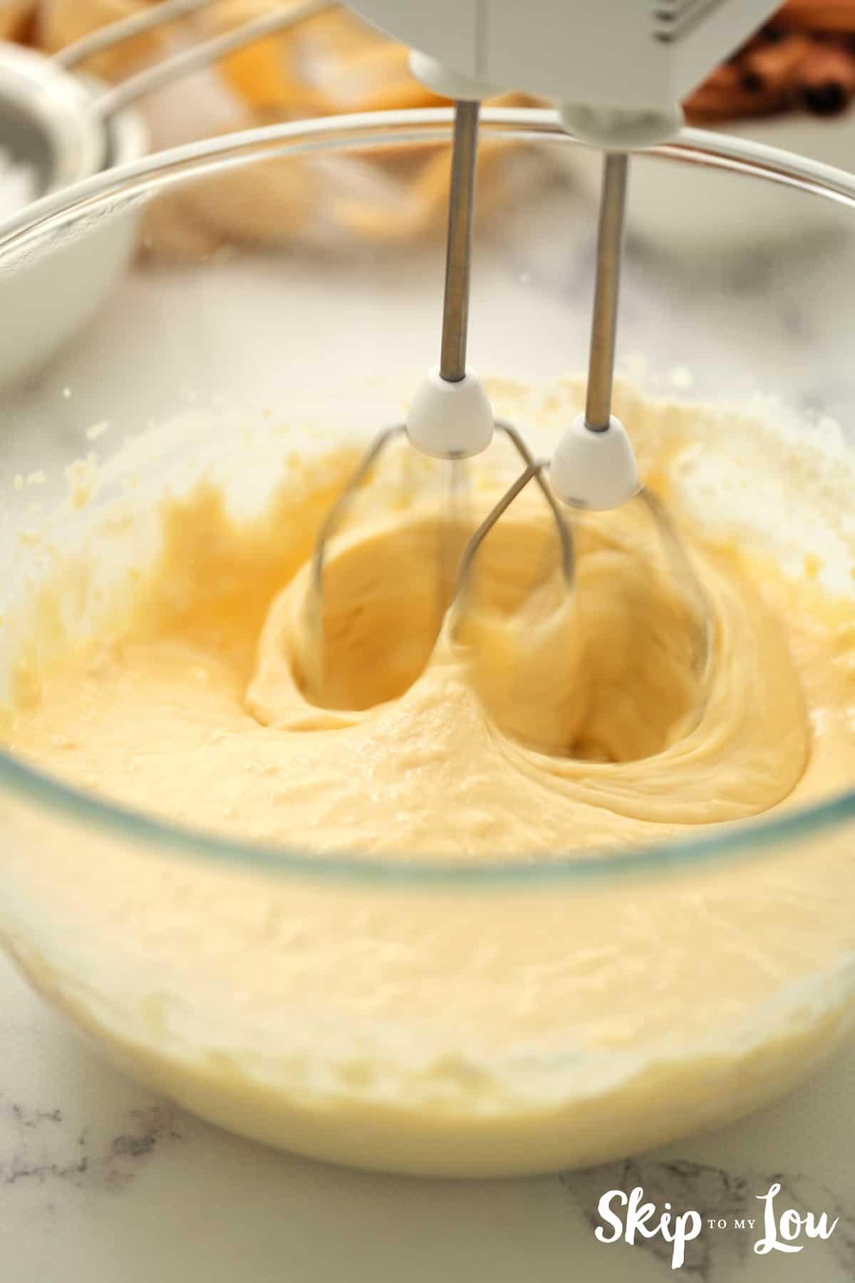 next step beating mixture with half flour to make a soft ball for the Cinnamon Rolls