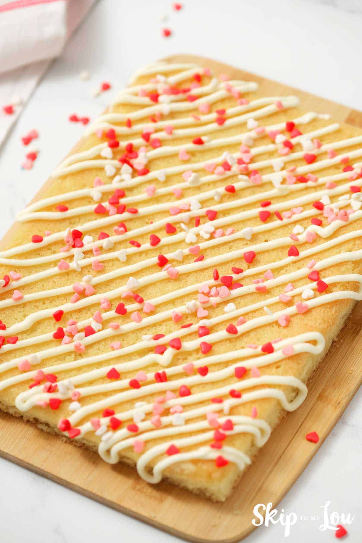 cake mix sugar cookies bars with frosting drizzle and sprinkles