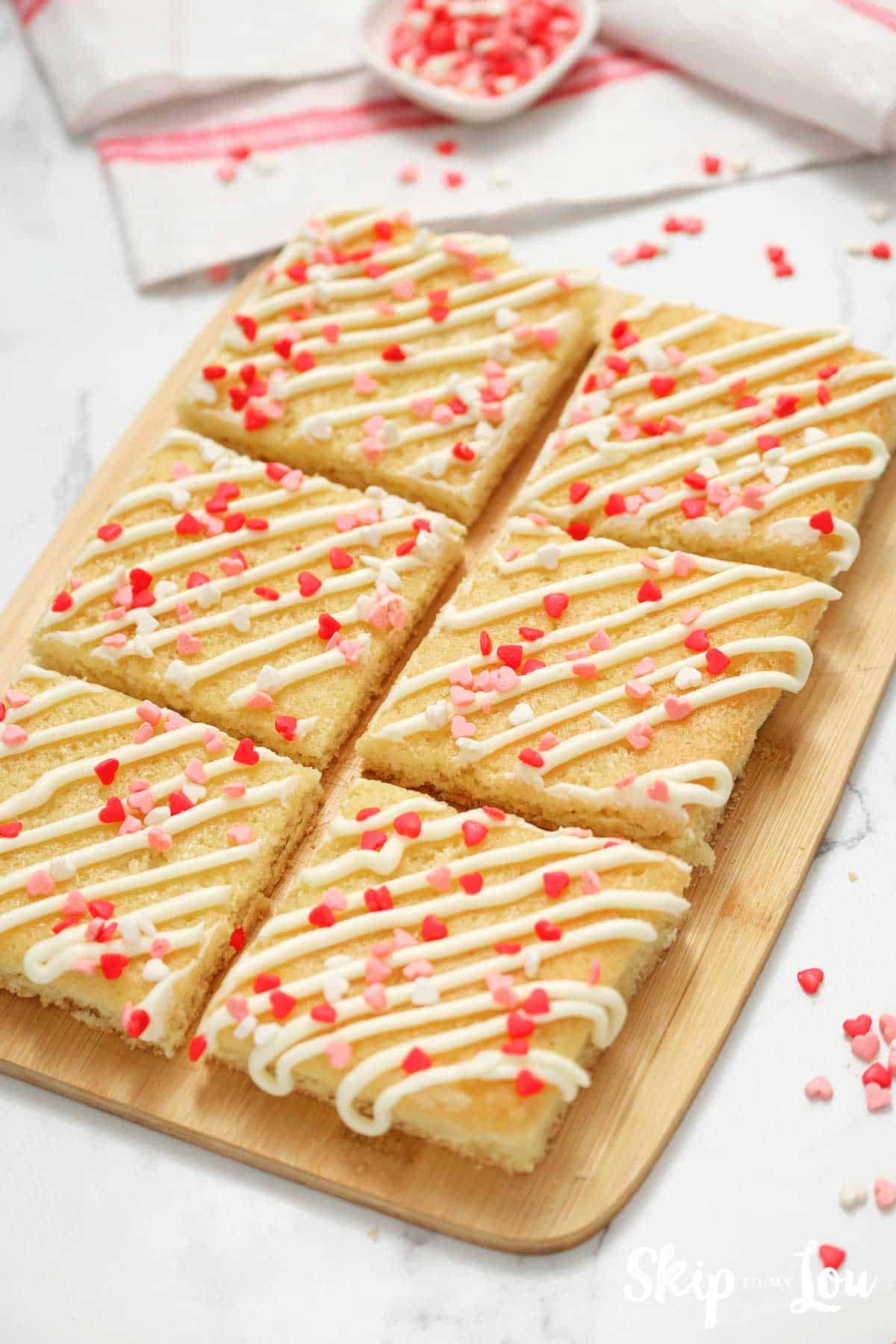 Cut sugar cookie bars on cutting board